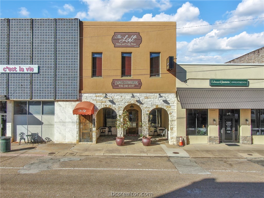 a view of a building with a street