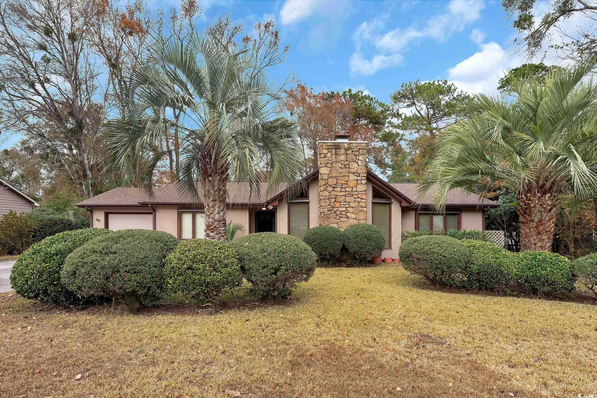 View of front of property with a front lawn