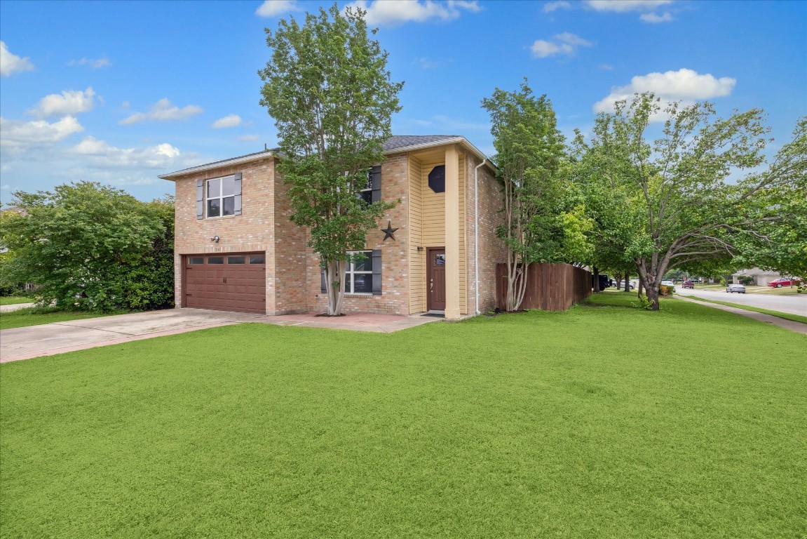 front view of a house with a yard