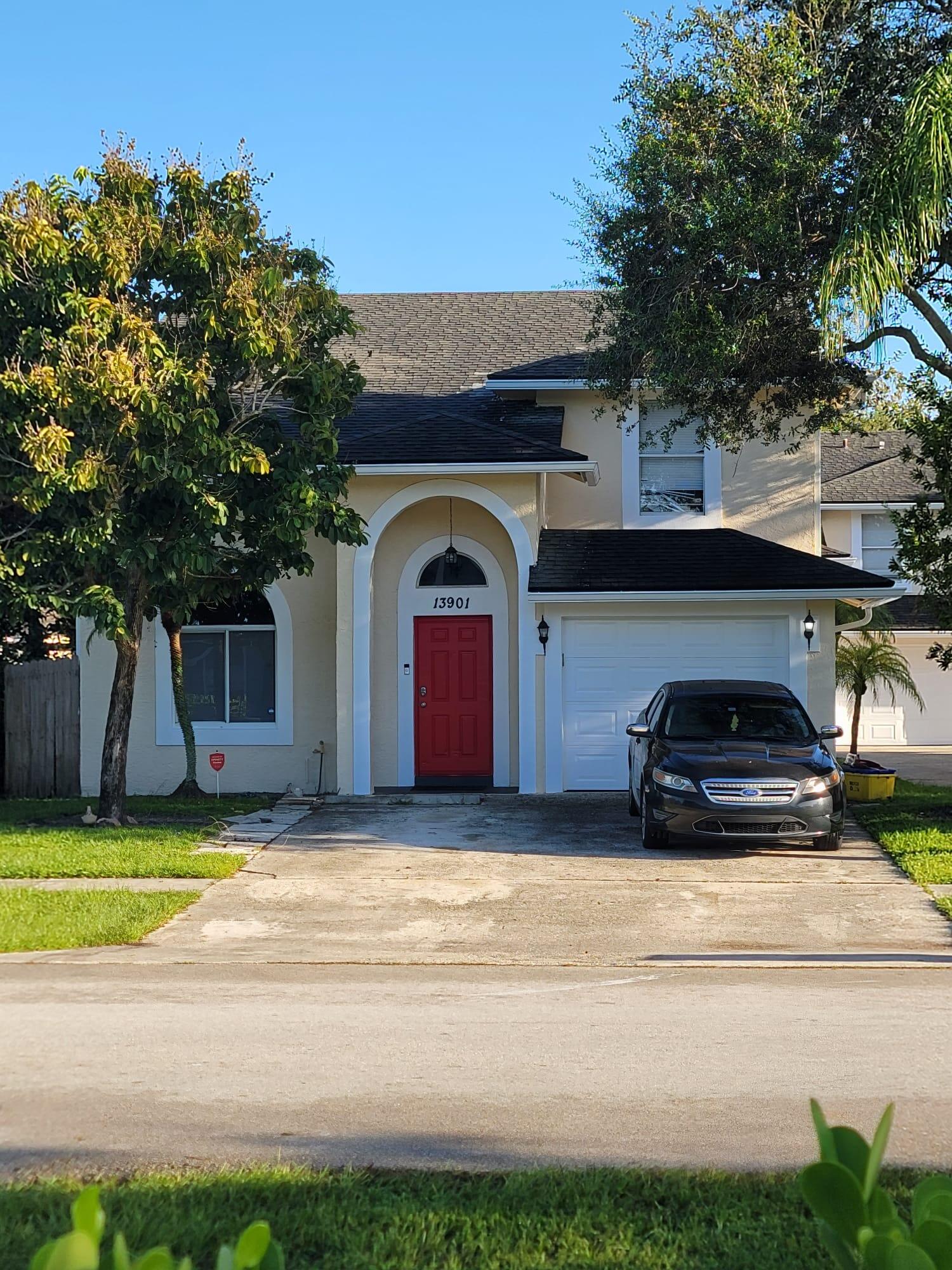 a view of a car parked in front of a house