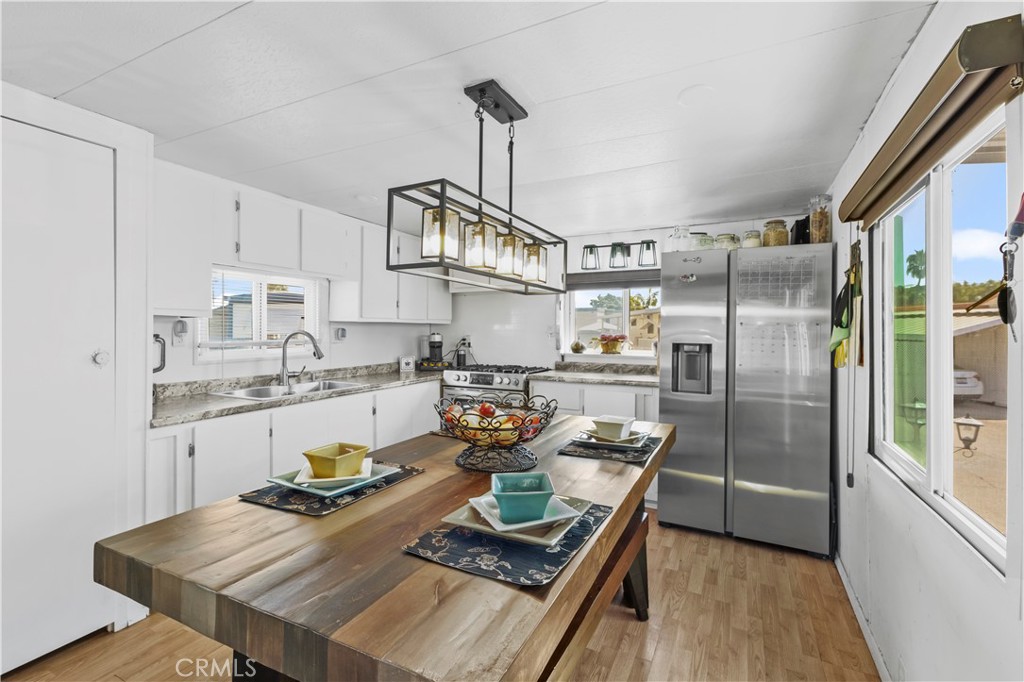 a kitchen with granite countertop lots of counter top space and stainless steel appliances