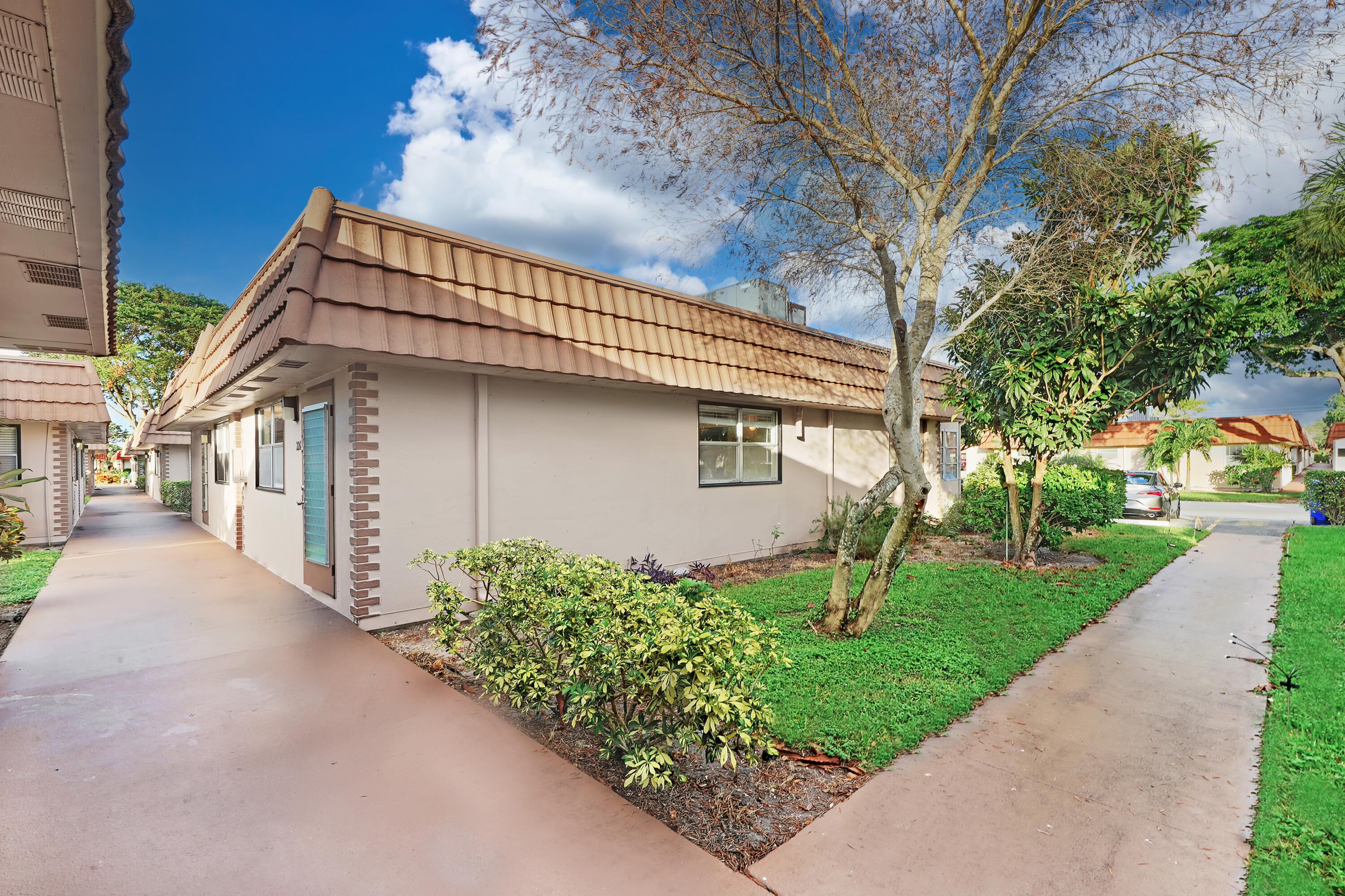 a front view of a house with garden