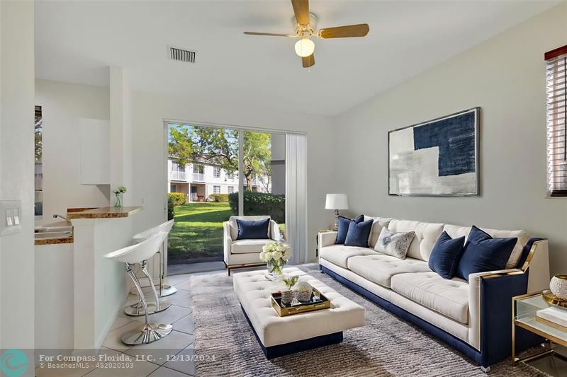 a living room with furniture rug and window