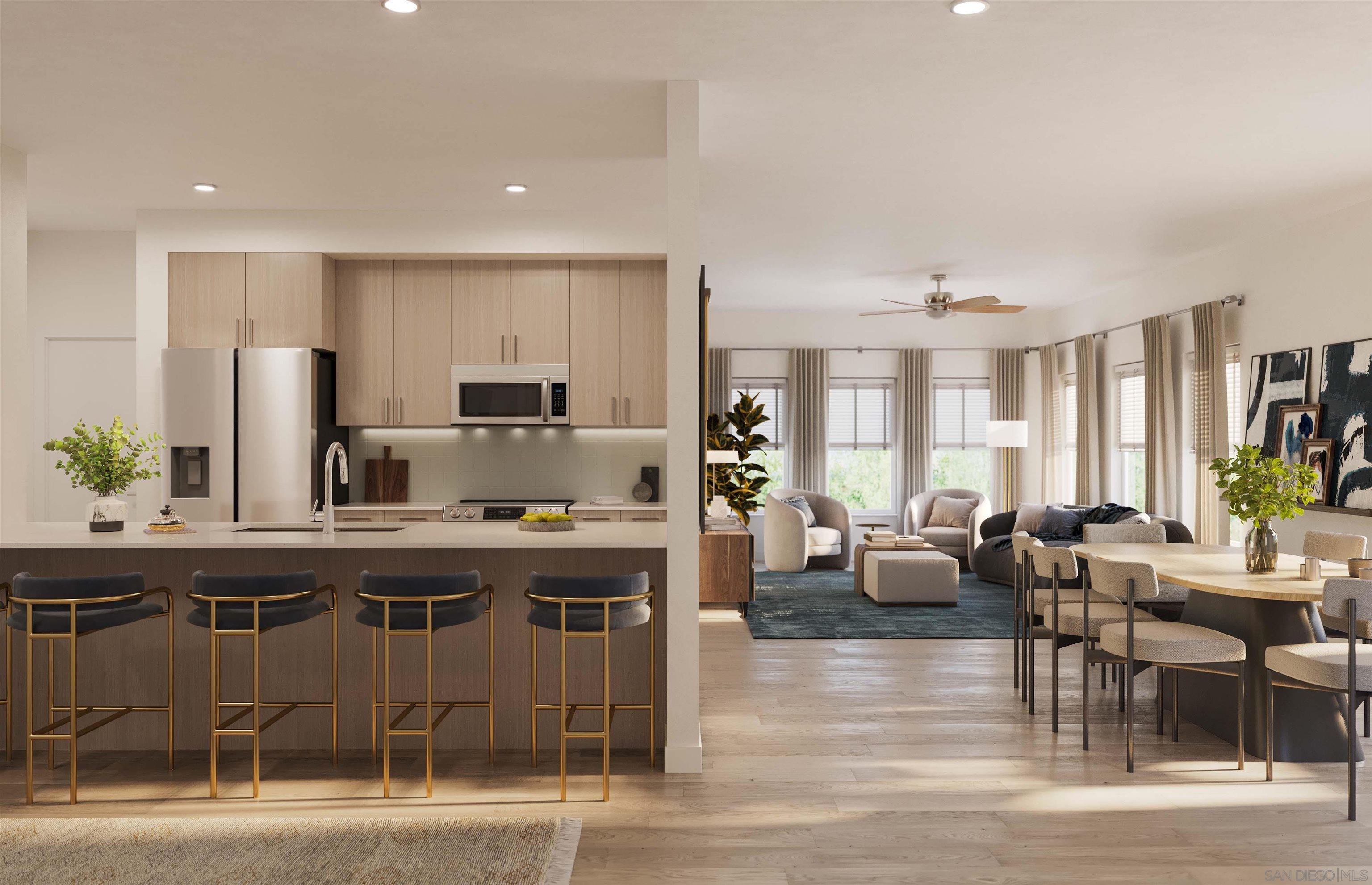 a large kitchen with a table and chairs