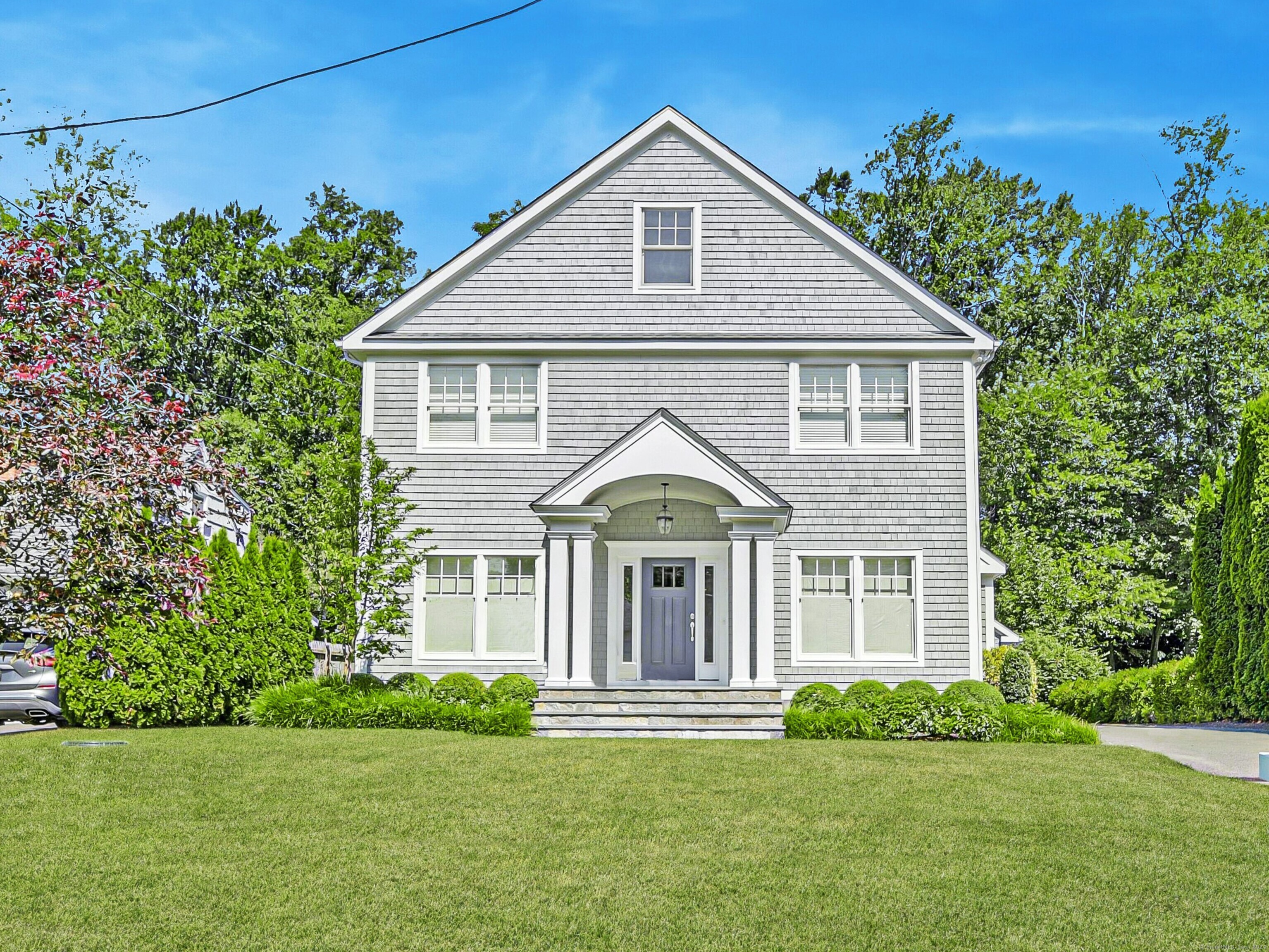 a front view of a house with a yard