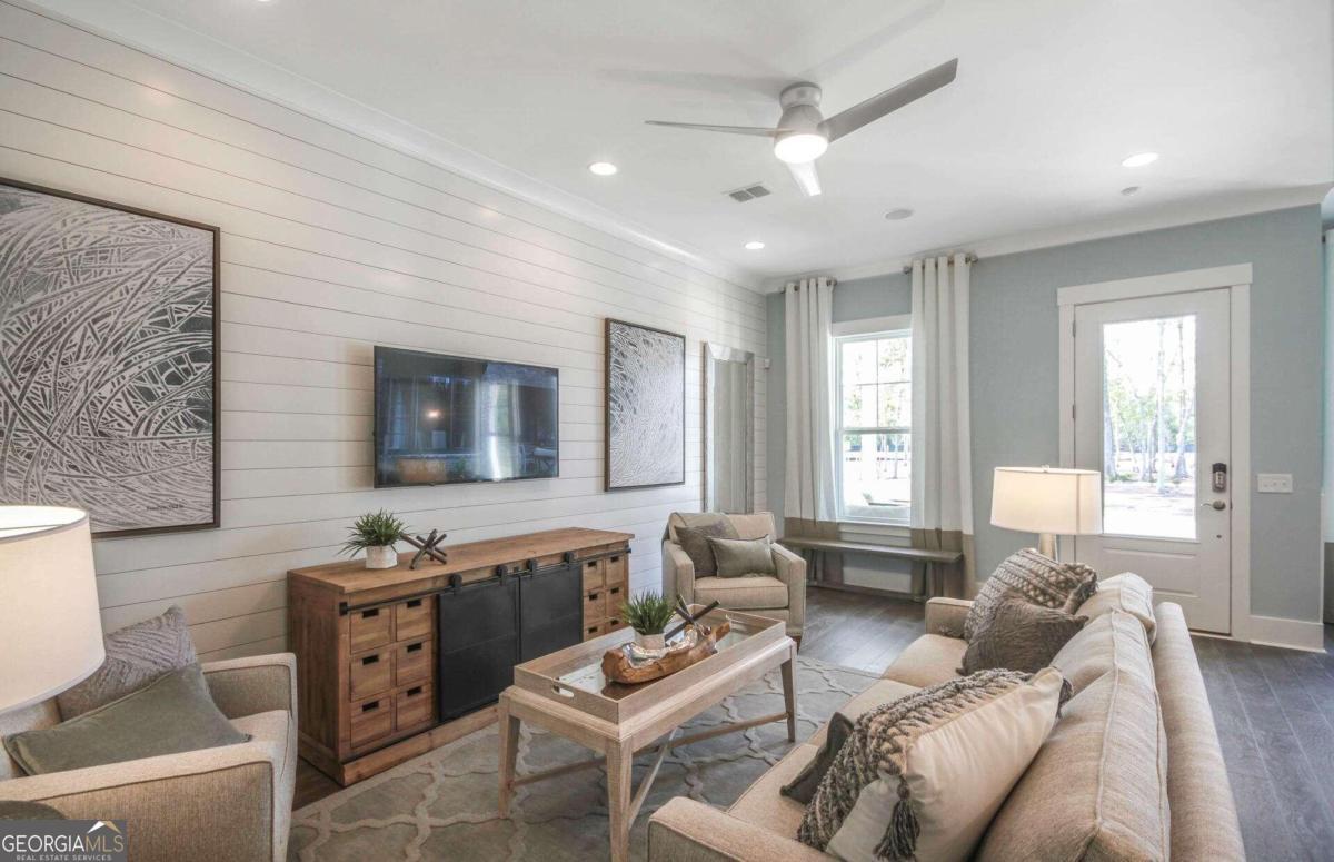 a living room with furniture and a window