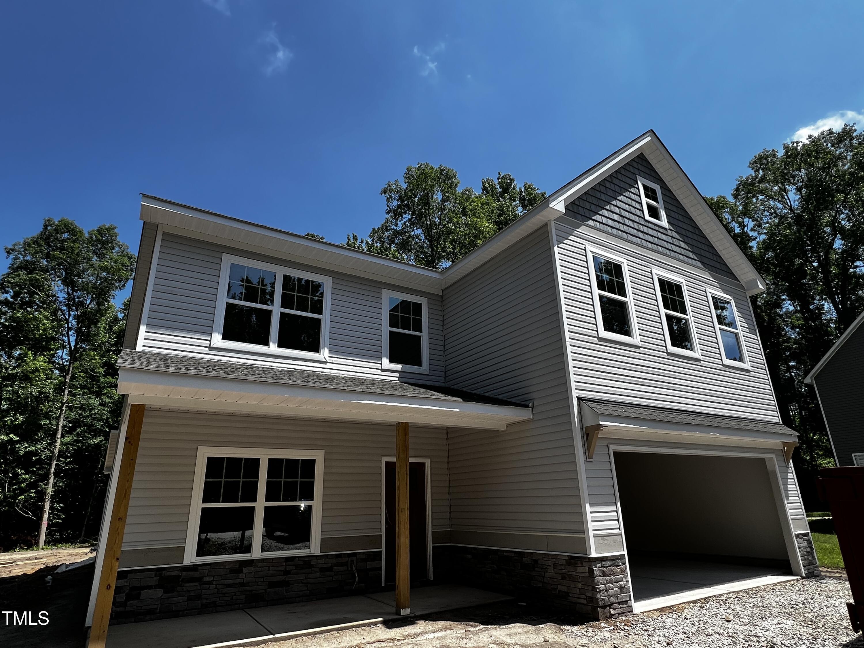 a front view of a house with a garage