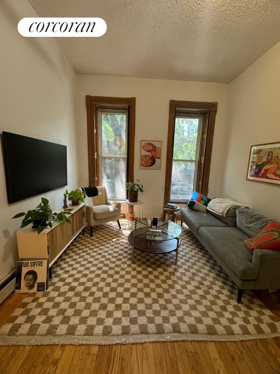 a living room with furniture and a flat screen tv