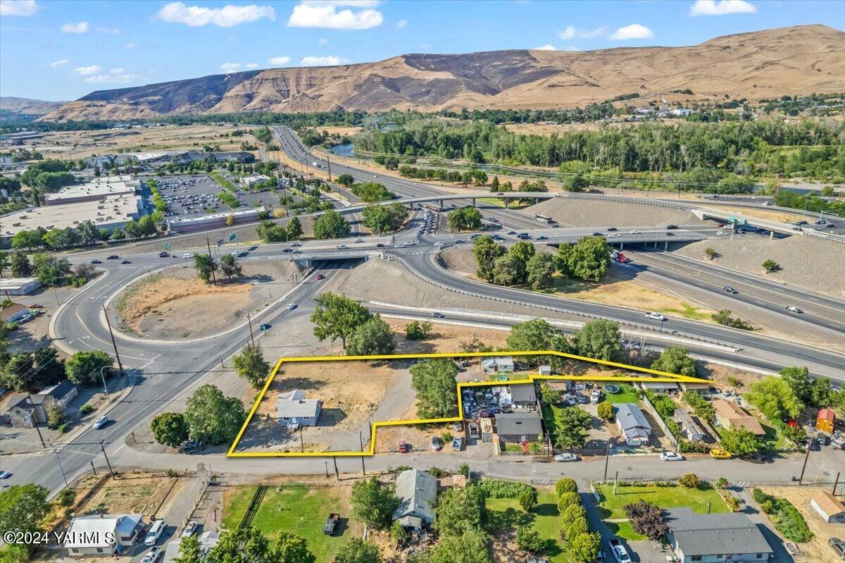 an aerial view of residential houses with outdoor space and river