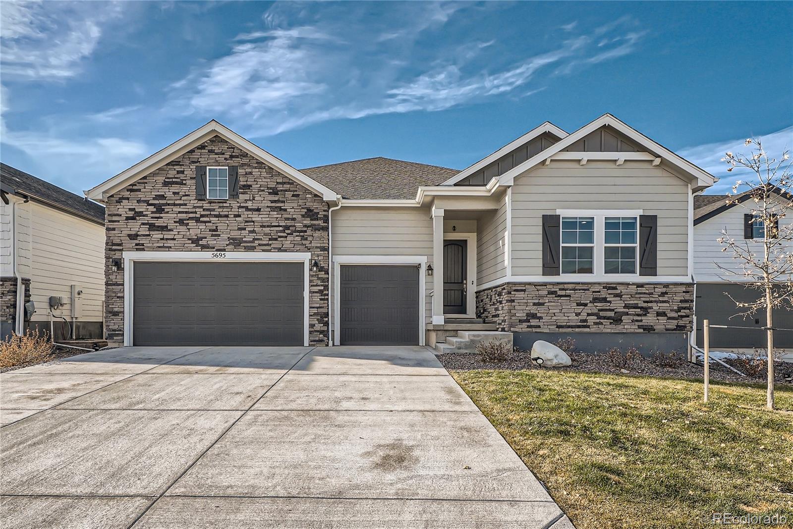 a front view of a house with garage