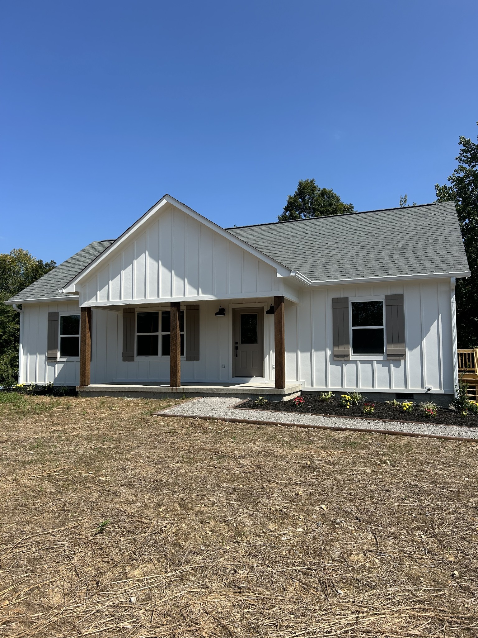 a front view of a house with a yard