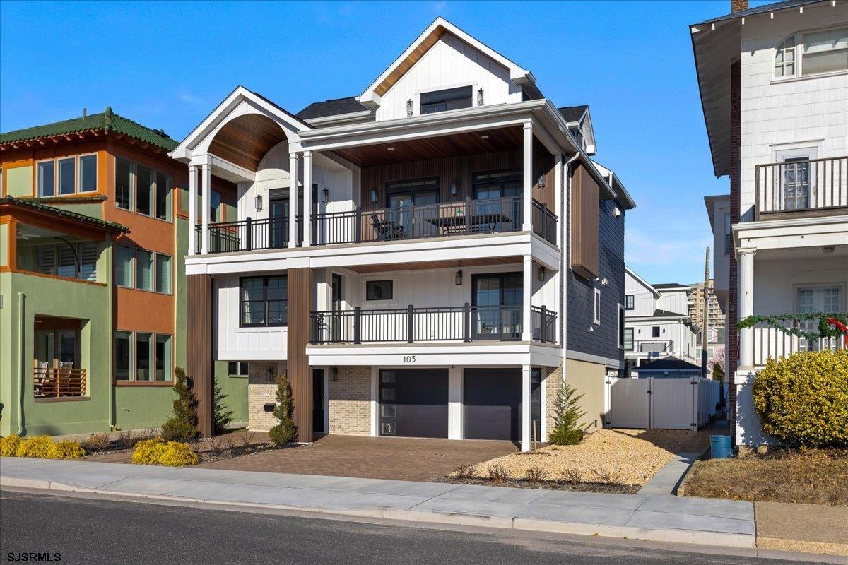 a front view of a residential apartment building with a yard