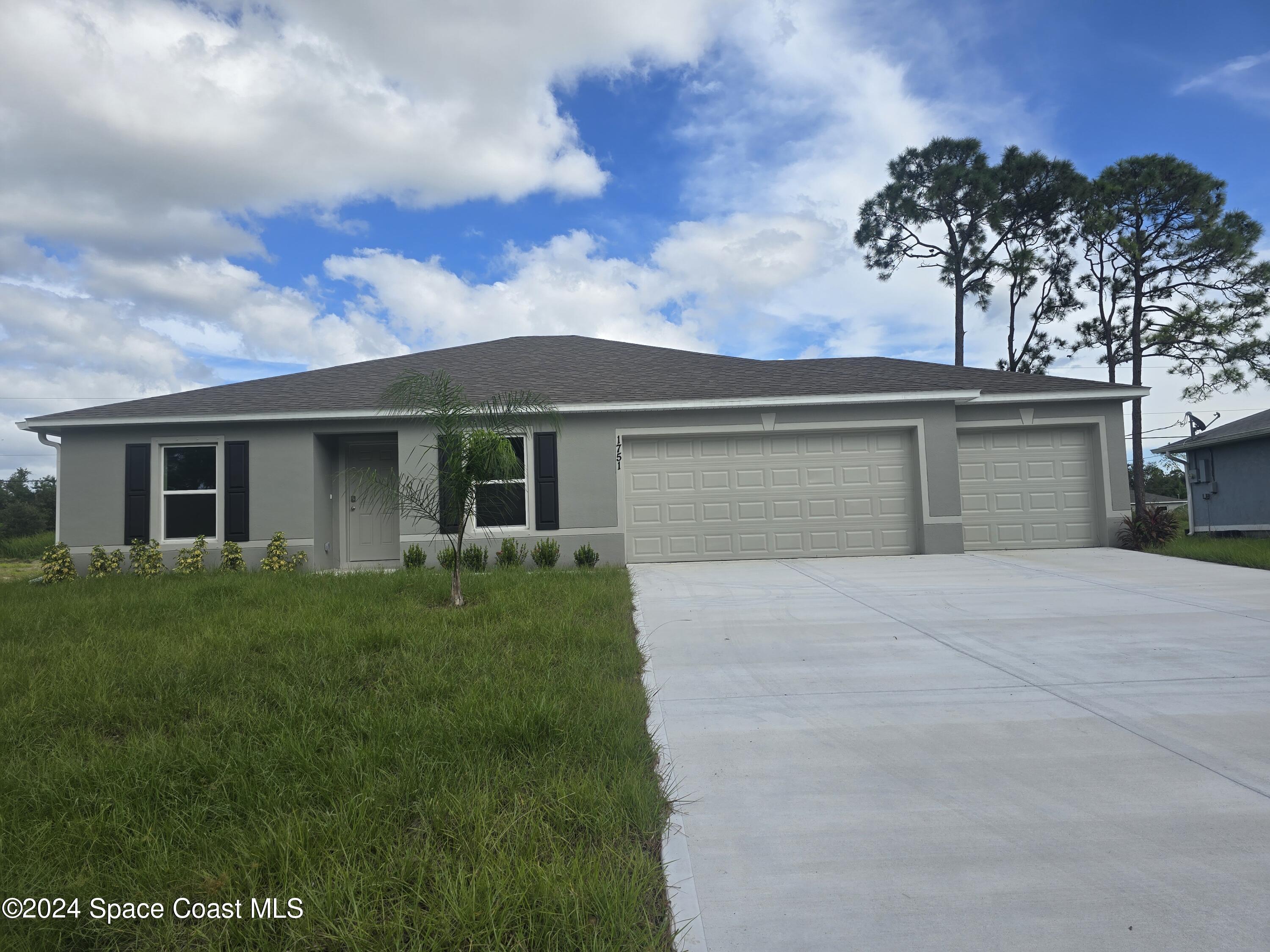 front view of house with a yard