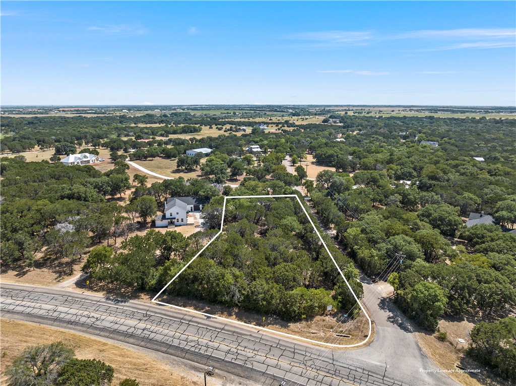 an aerial view of residential houses with city view