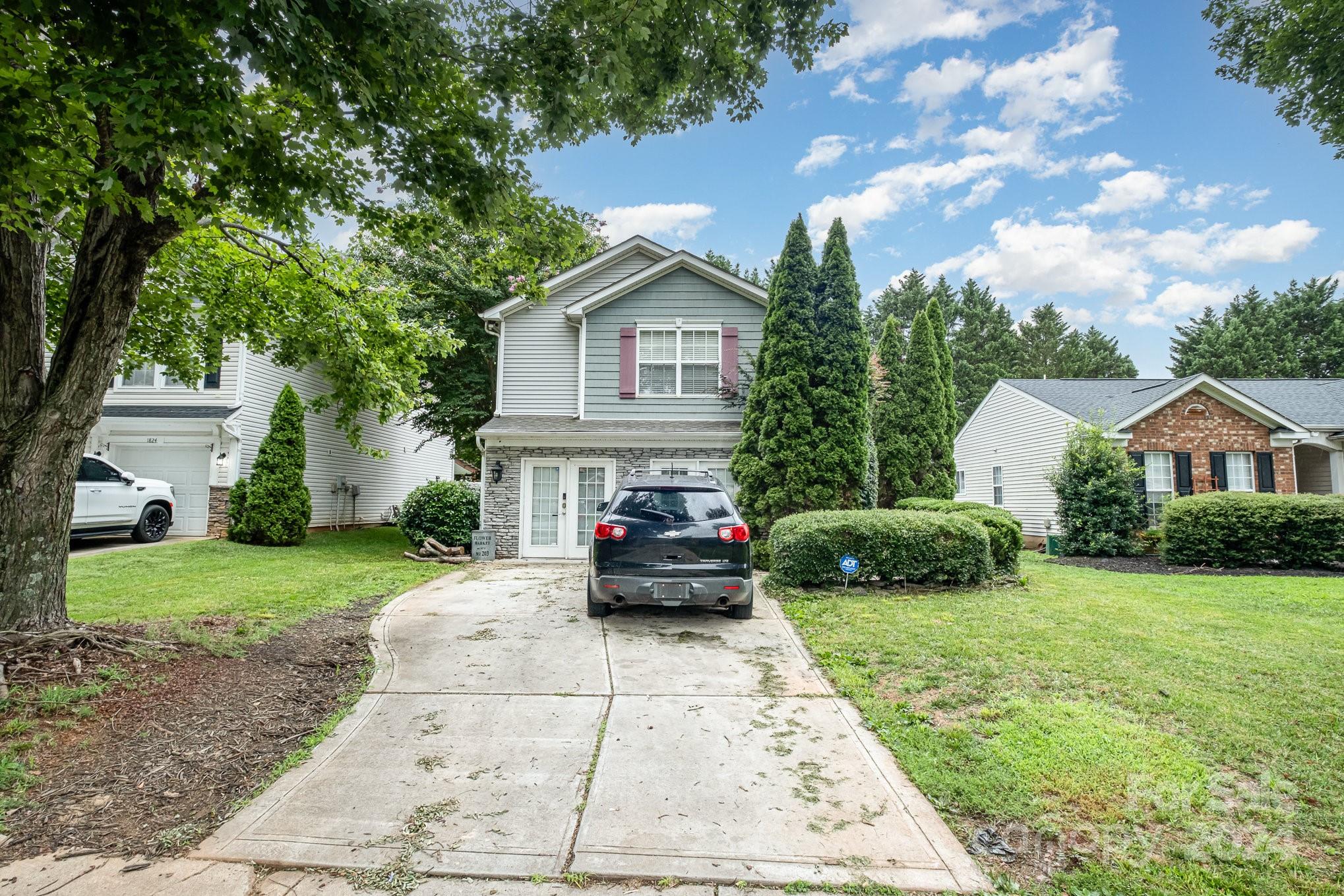 a view of a house with a garden