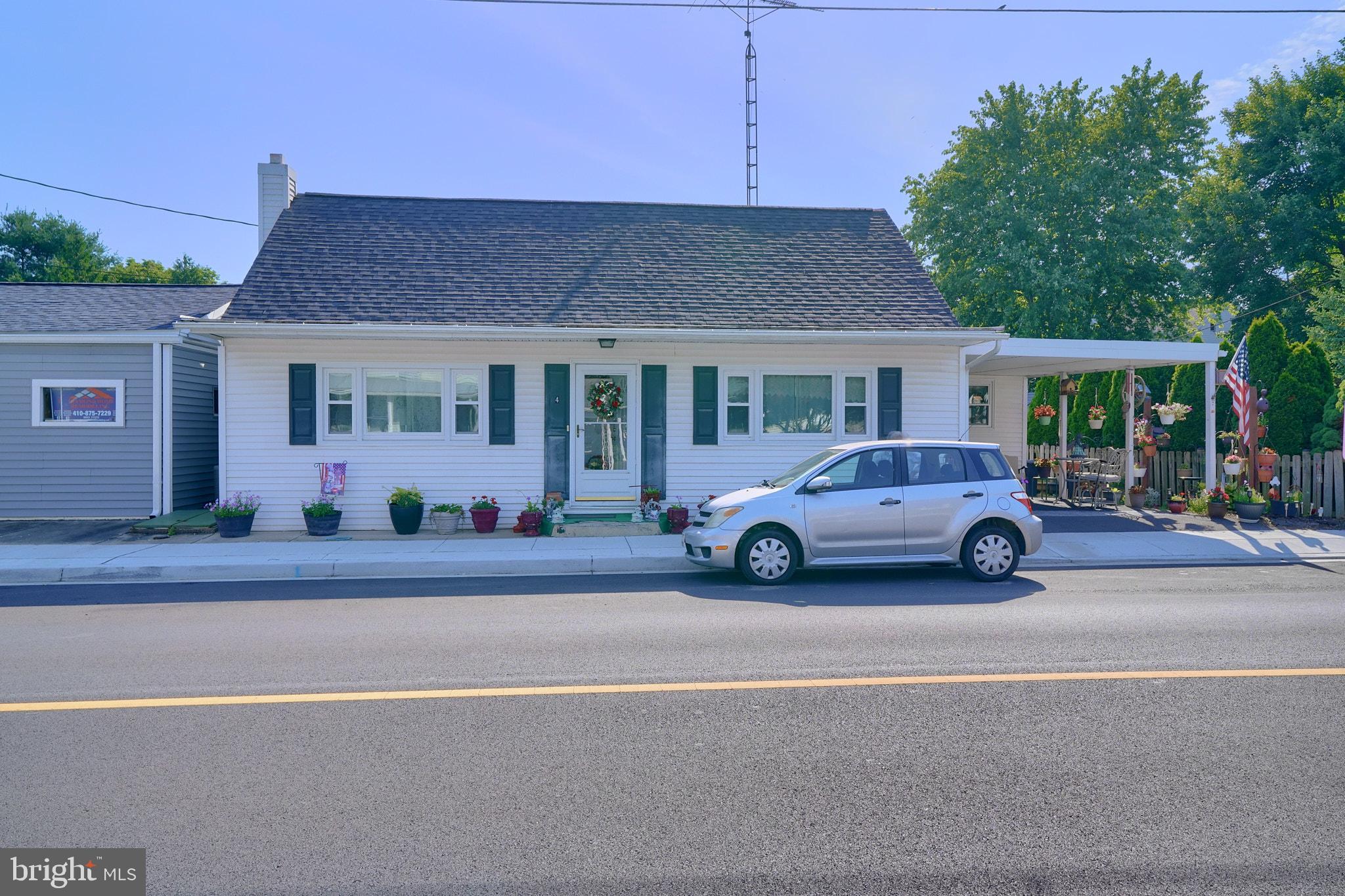 a view of a car parked in front of a house