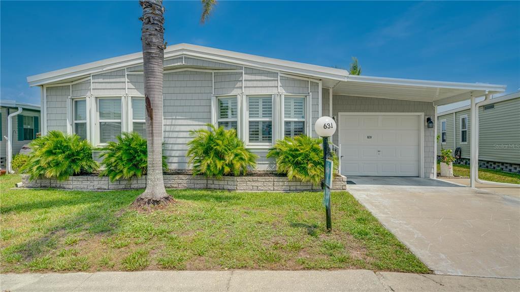 front view of a house with a yard