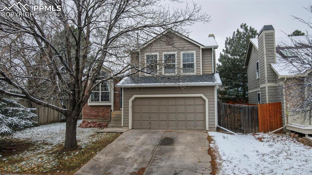 View of property with a garage