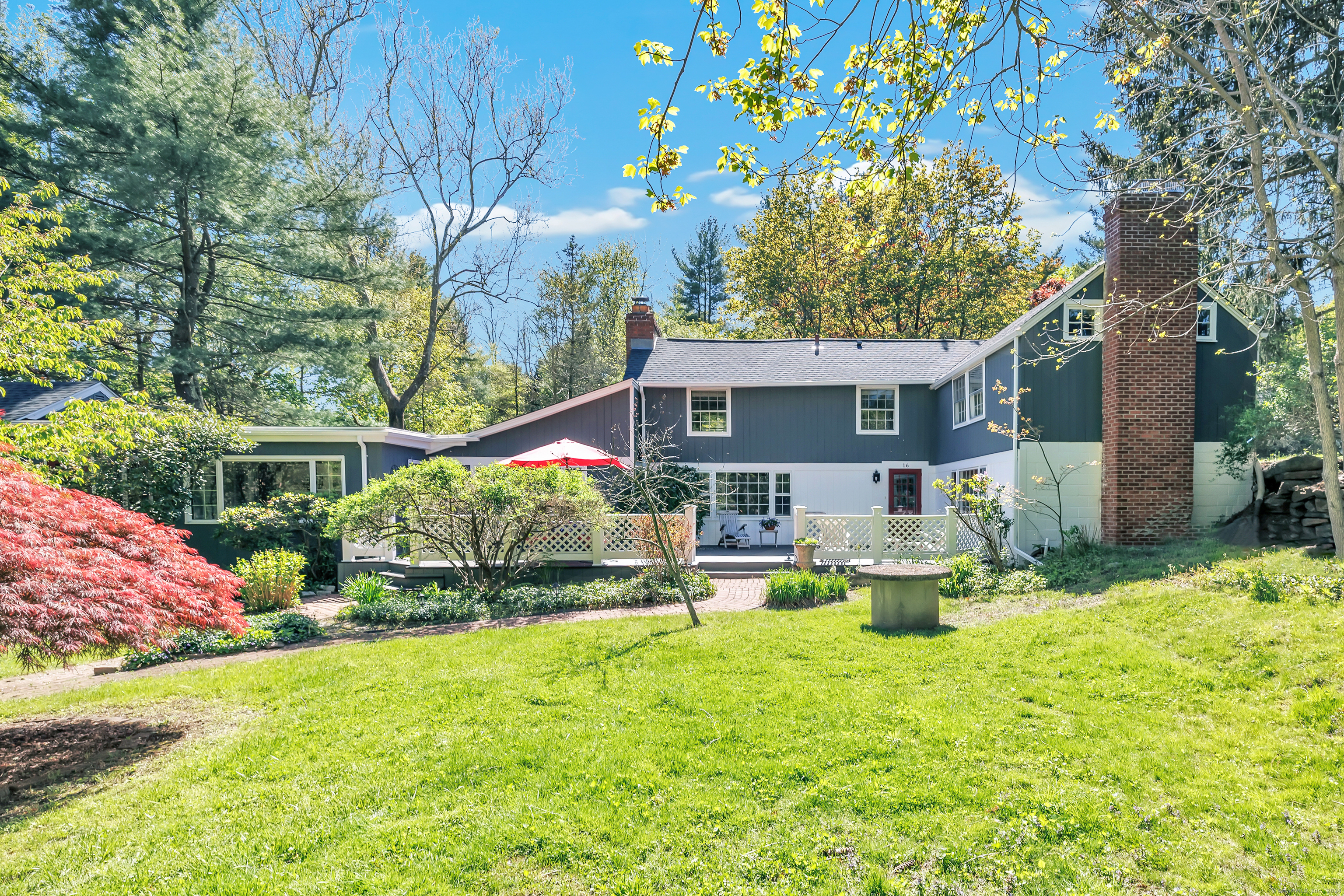 a front view of house with yard and seating area