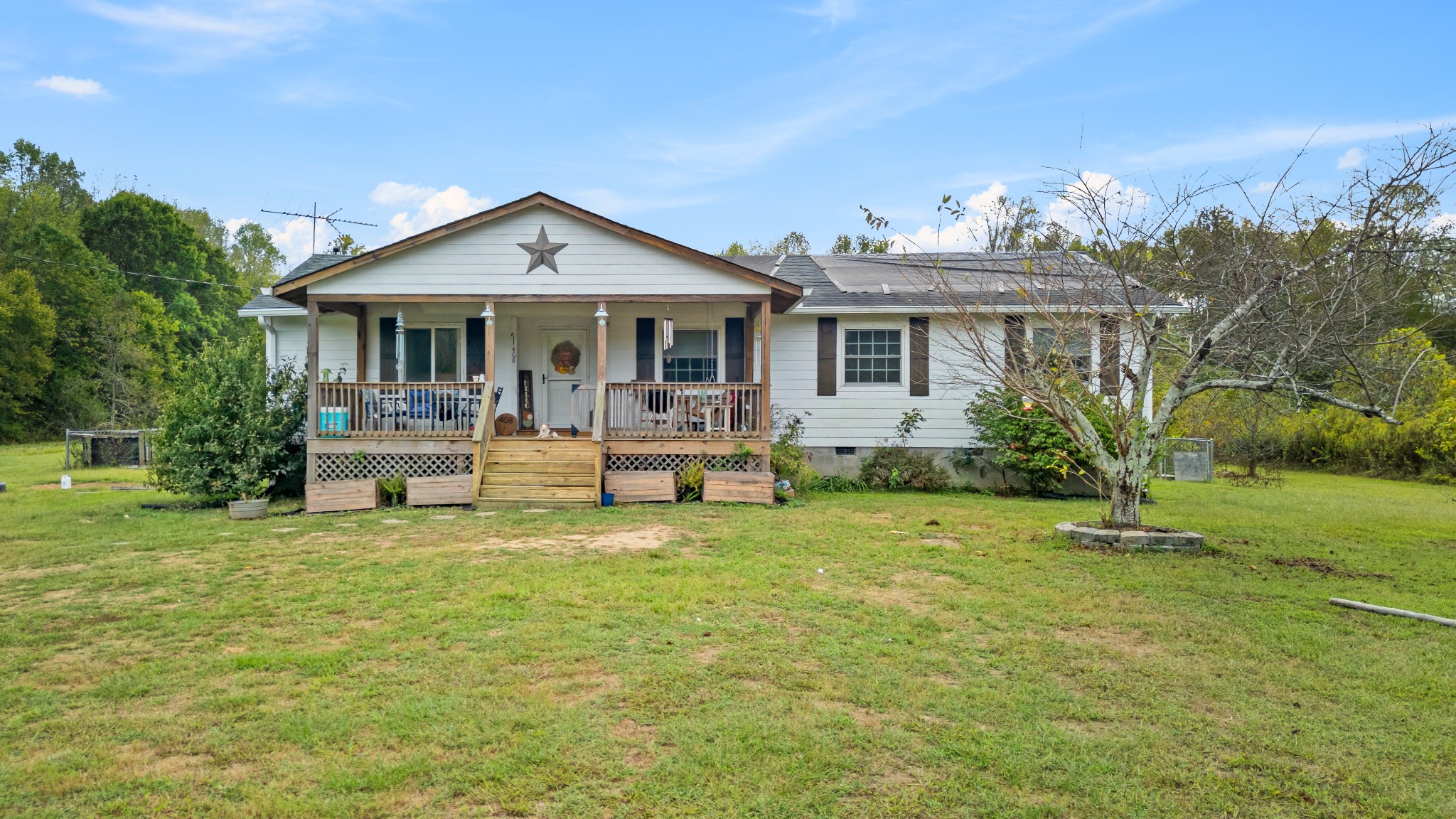 a front view of a house with garden