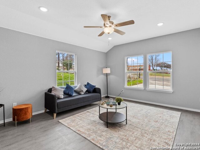 a living room with furniture and a window