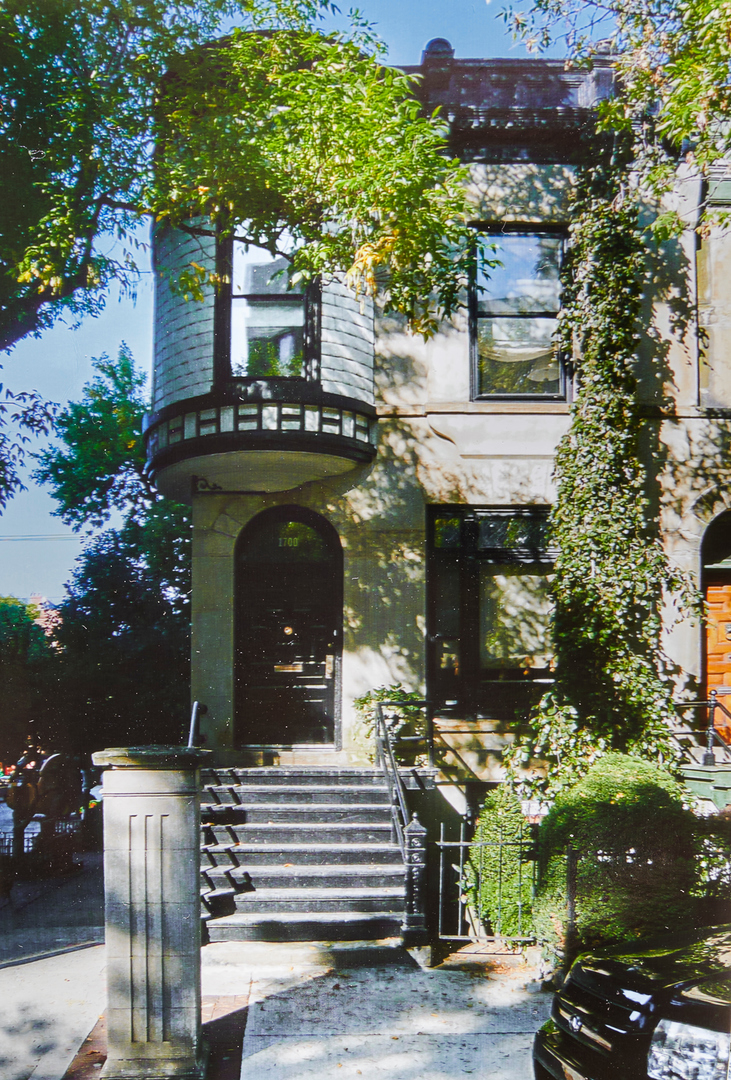 a view of a building with a tree