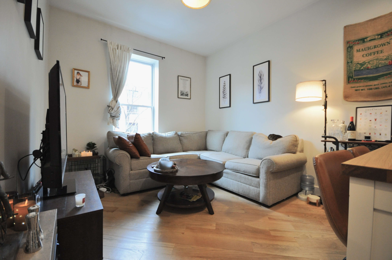 a living room with furniture and a flat screen tv