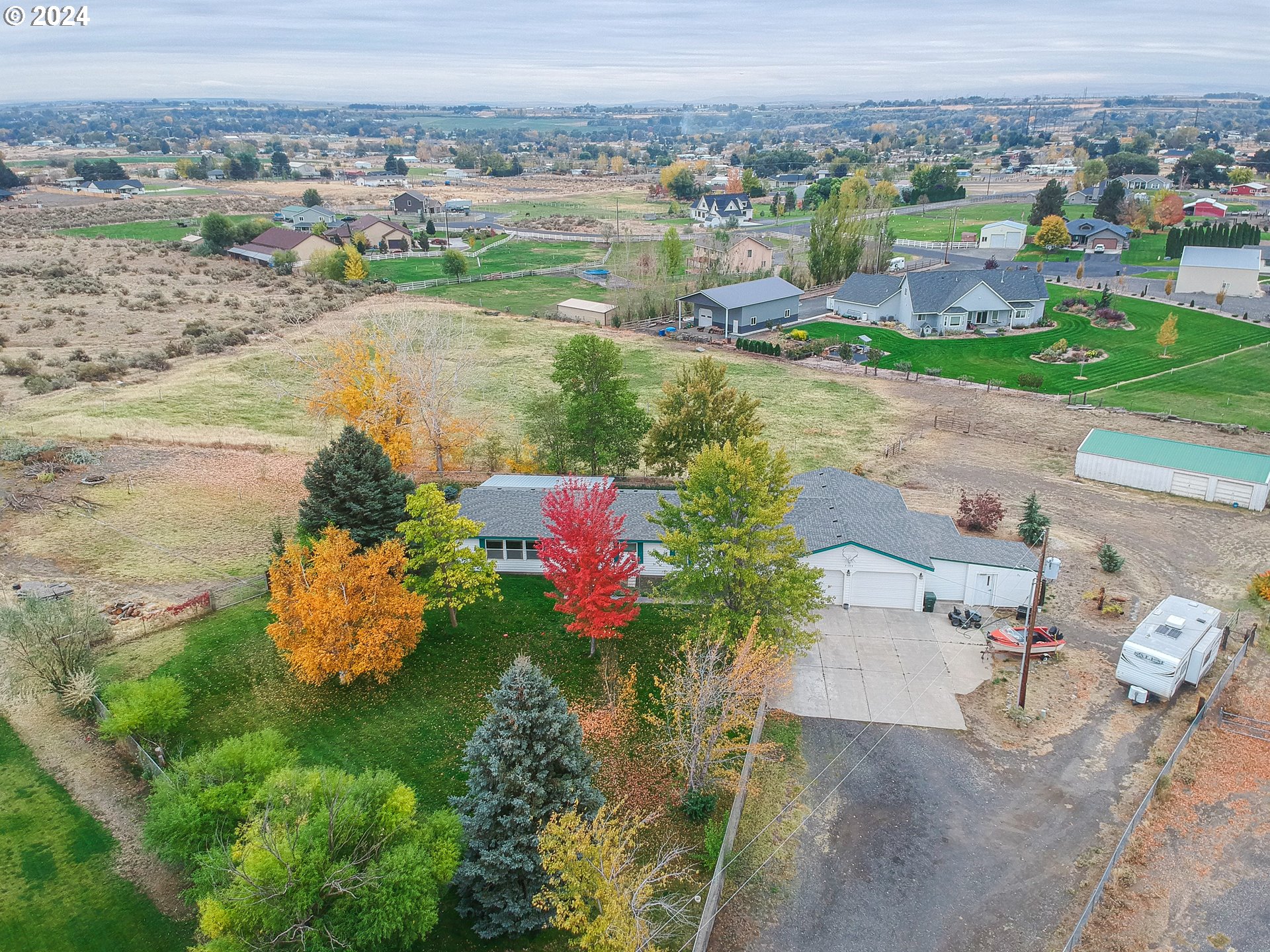 an aerial view of a house with a lake view