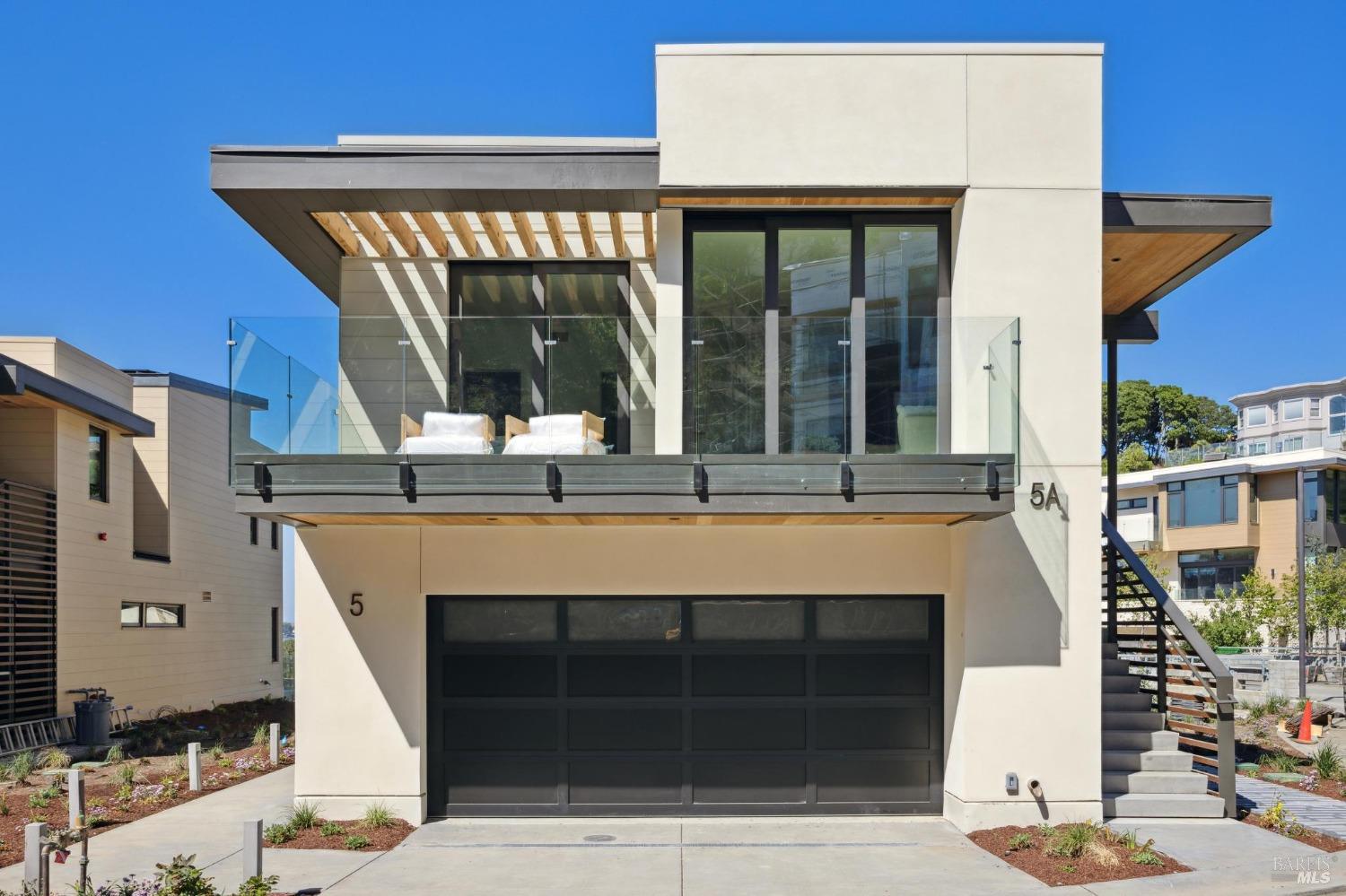 a front view of a house with glass windows