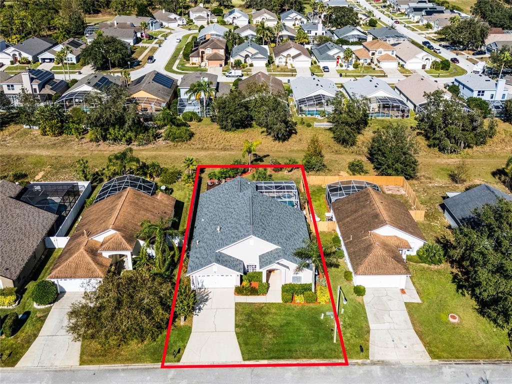 an aerial view of residential houses with outdoor space