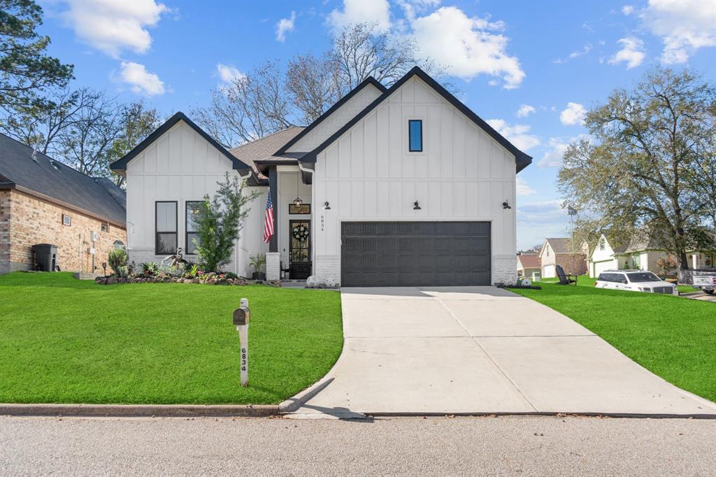 Modern farmhouse style on a large corner lot.