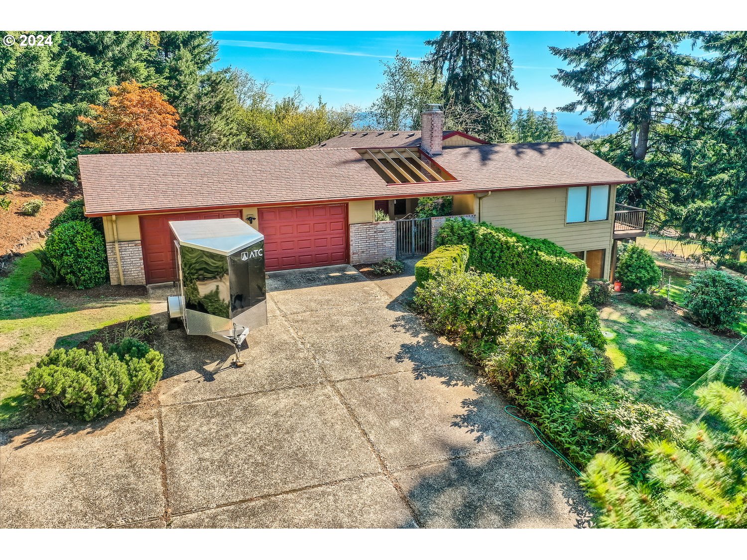 a aerial view of a house with a yard