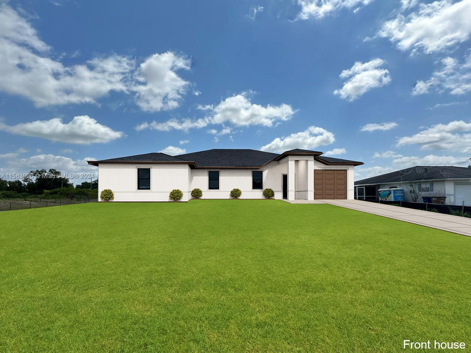 a front view of house with yard and green space