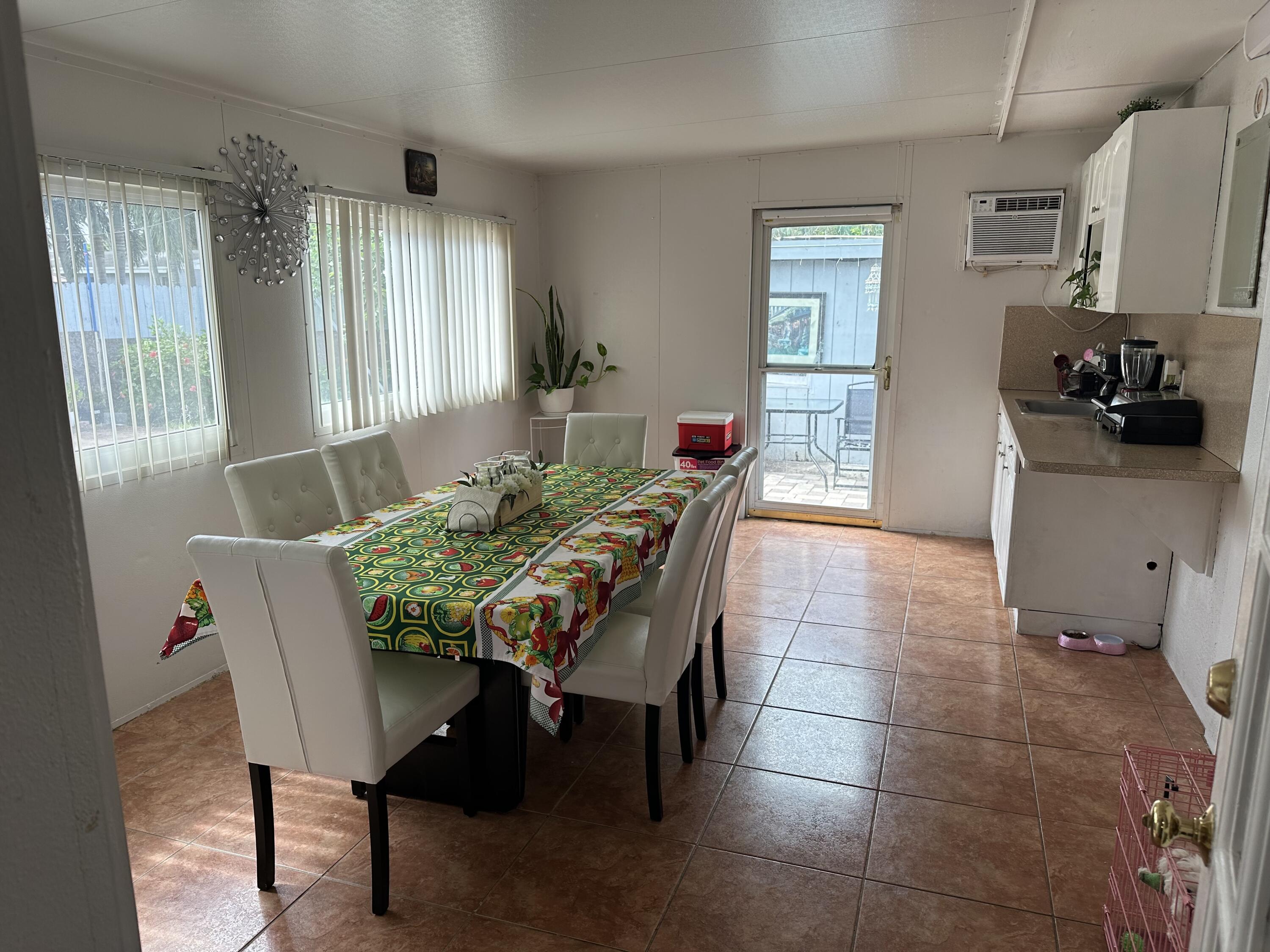 a dining room with furniture and window