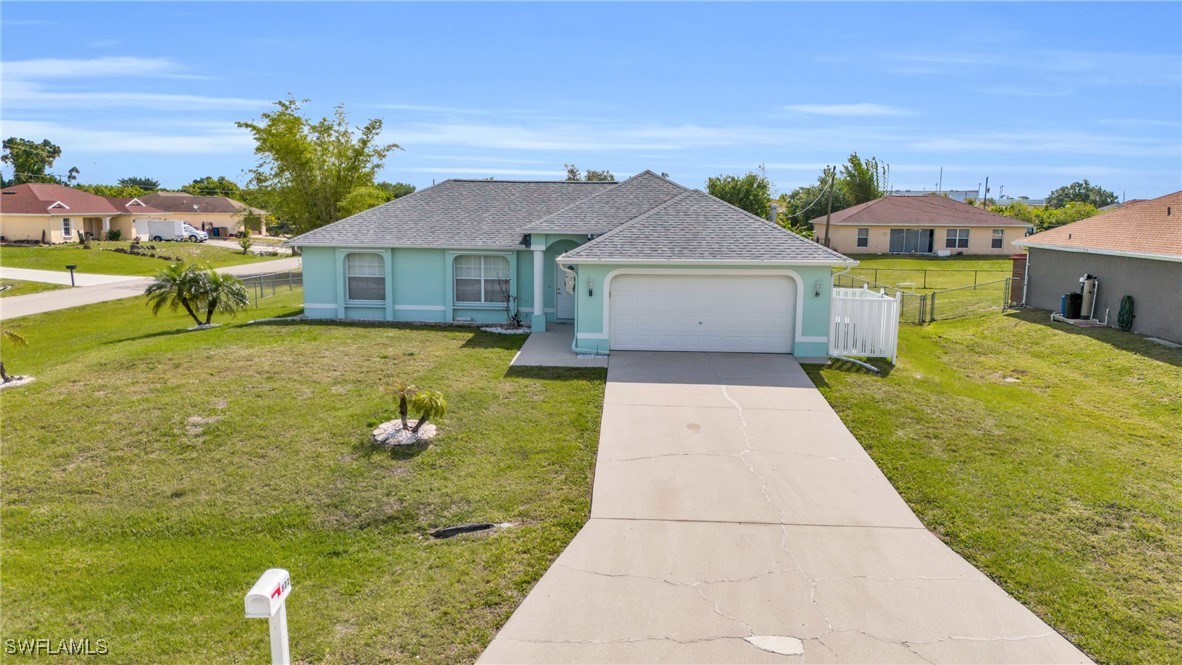 a view of a house with a yard