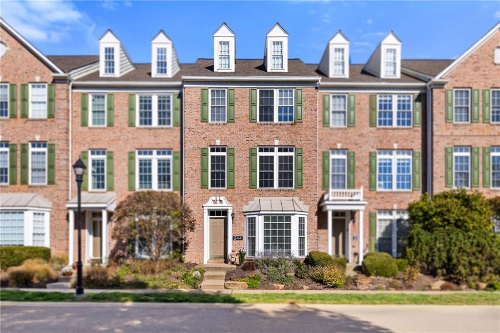 a front view of multi story residential apartment building