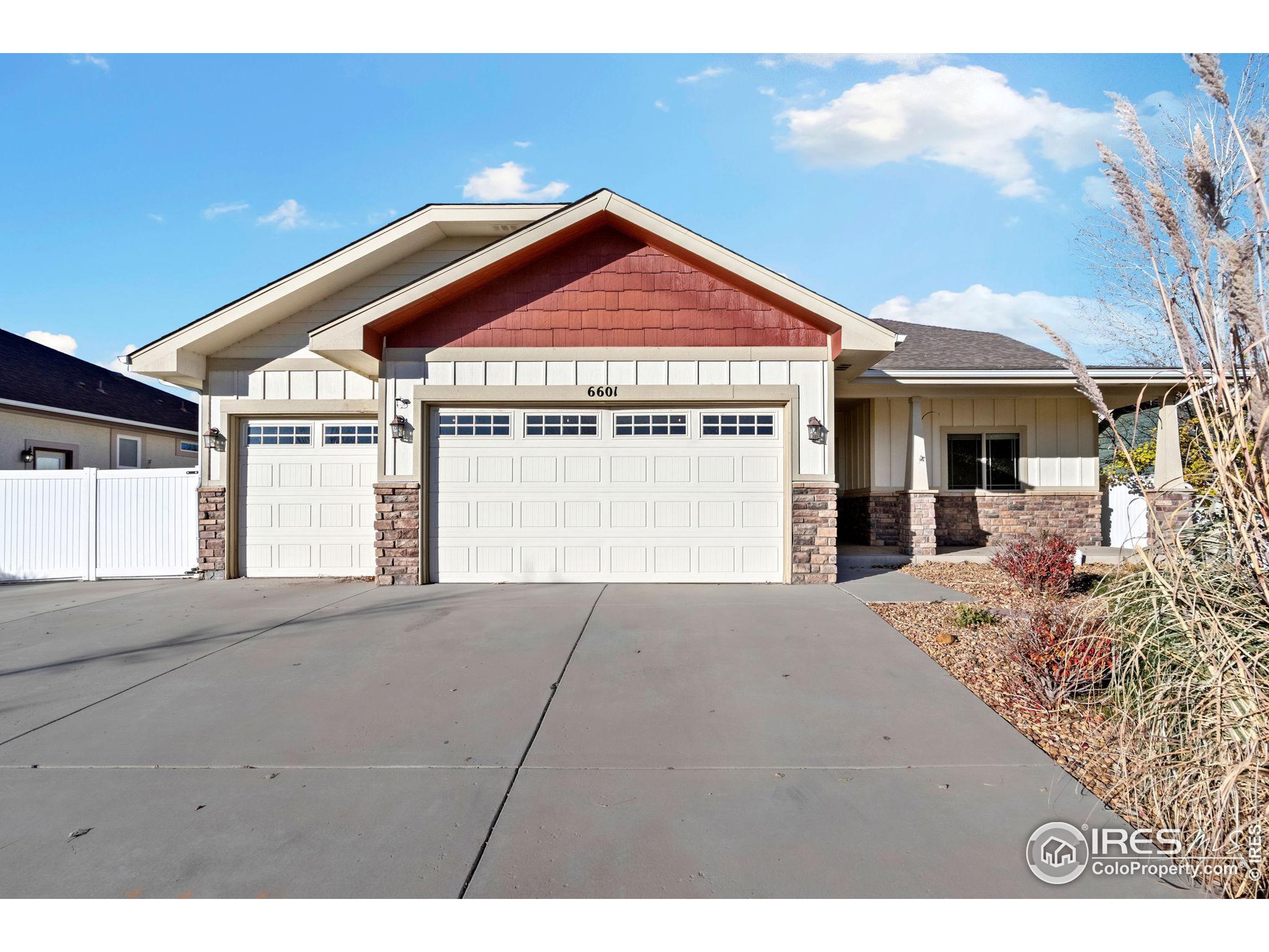 a view of a house with a yard and garage