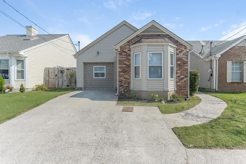 front view of a house with a yard