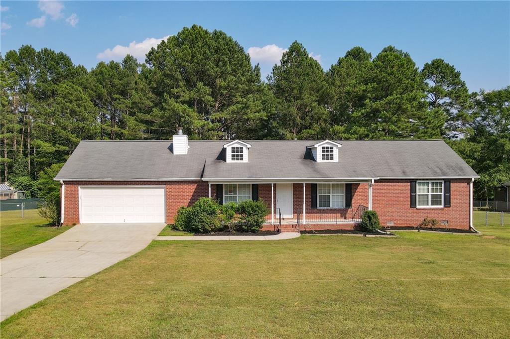 front view of a house with a yard