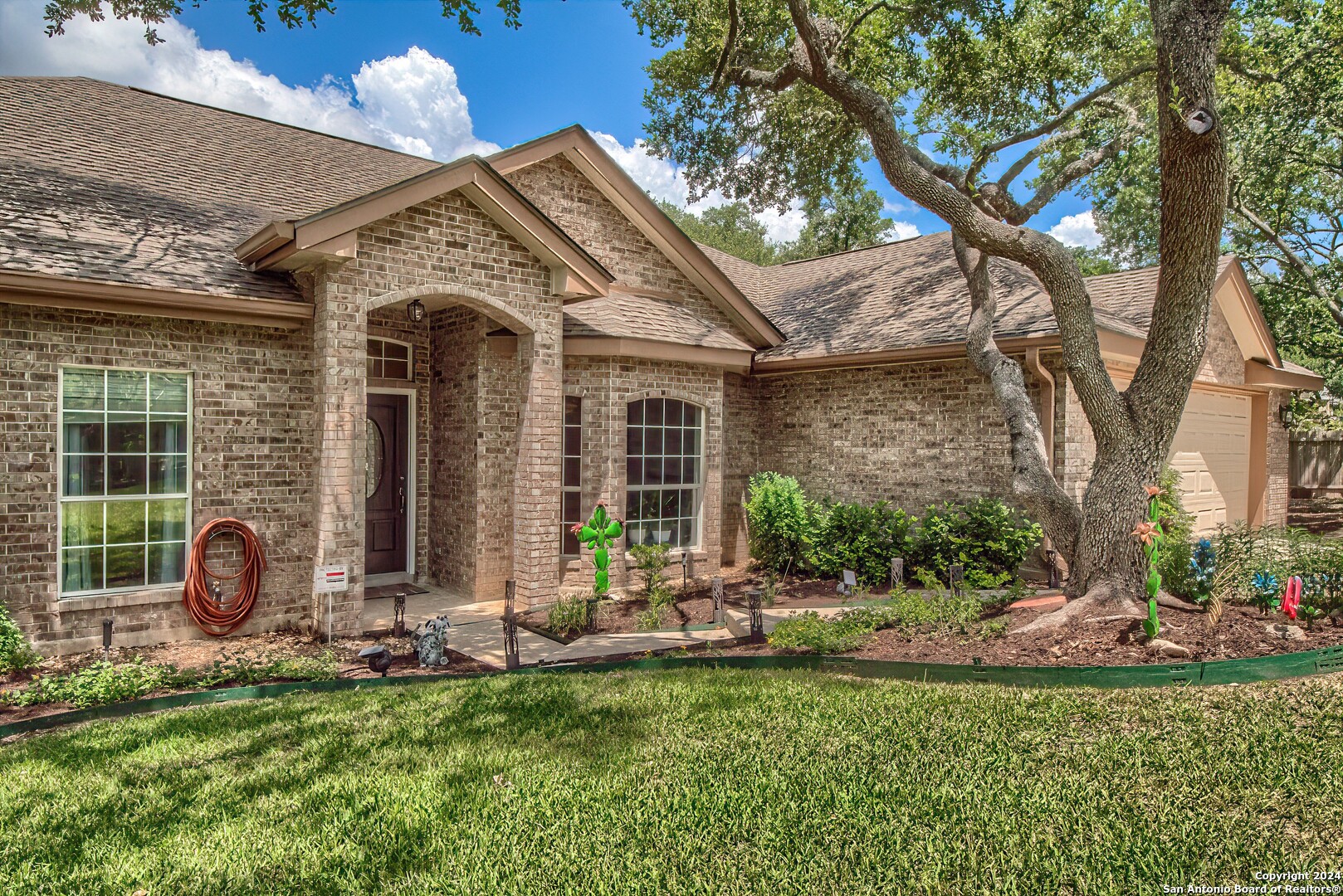 a front view of a house with garden