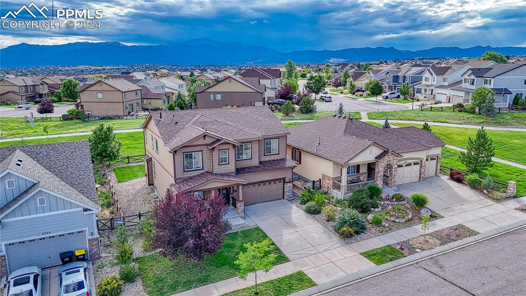 an aerial view of a house with a garden