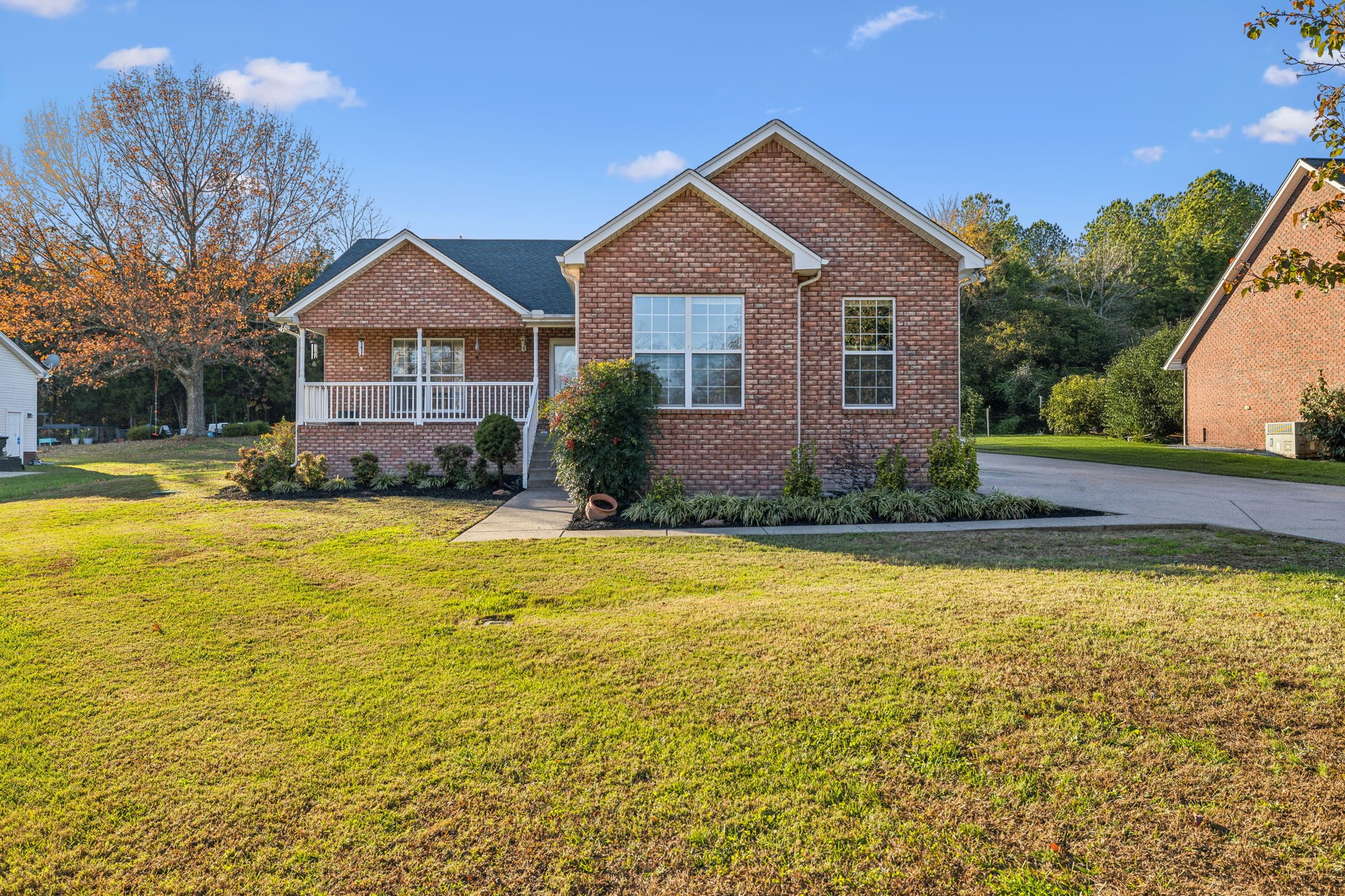 a front view of a house with a yard