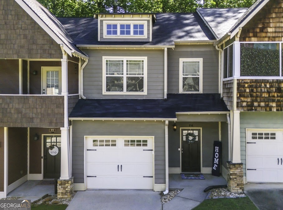 a front view of a house with a garage