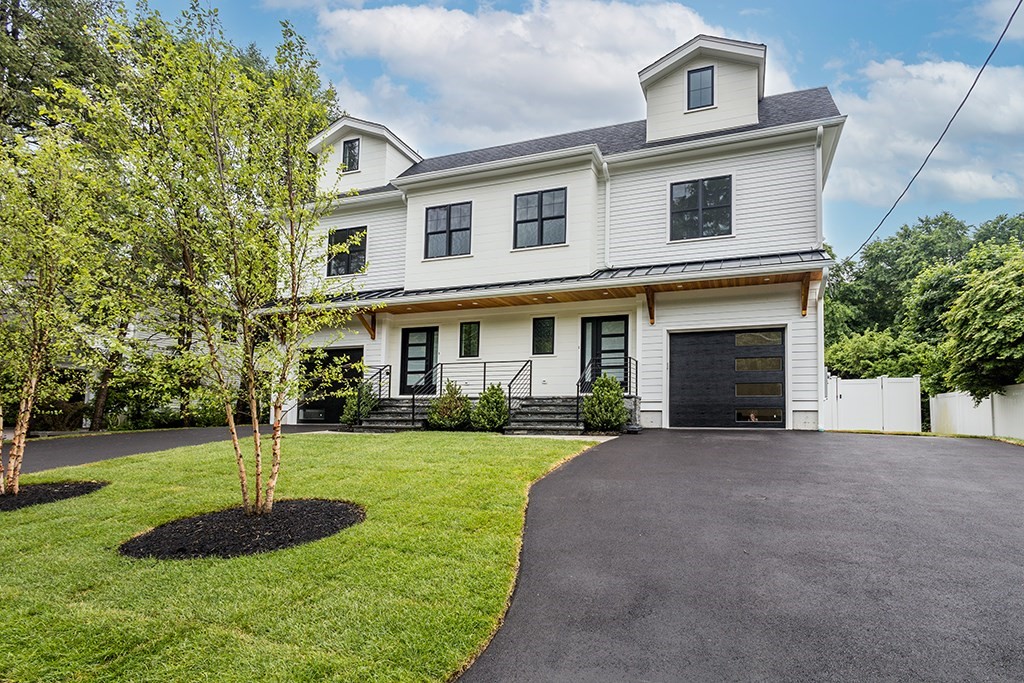 a front view of a house with a yard