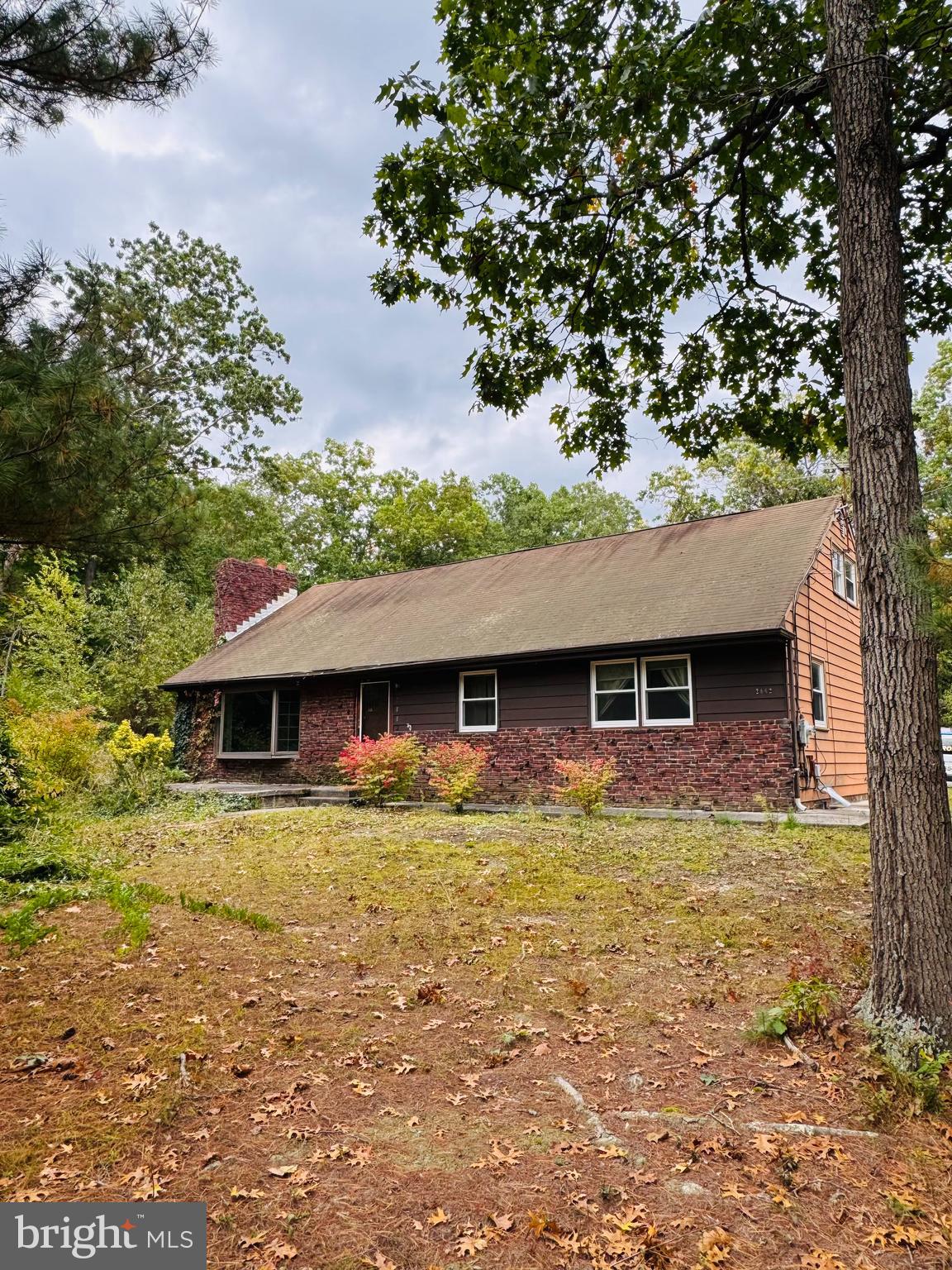 a view of a house with pool yard and front view of a house