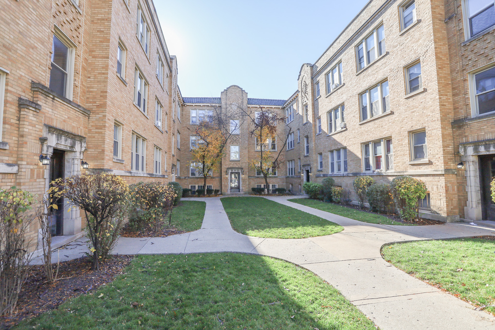 a view of a building with a yard