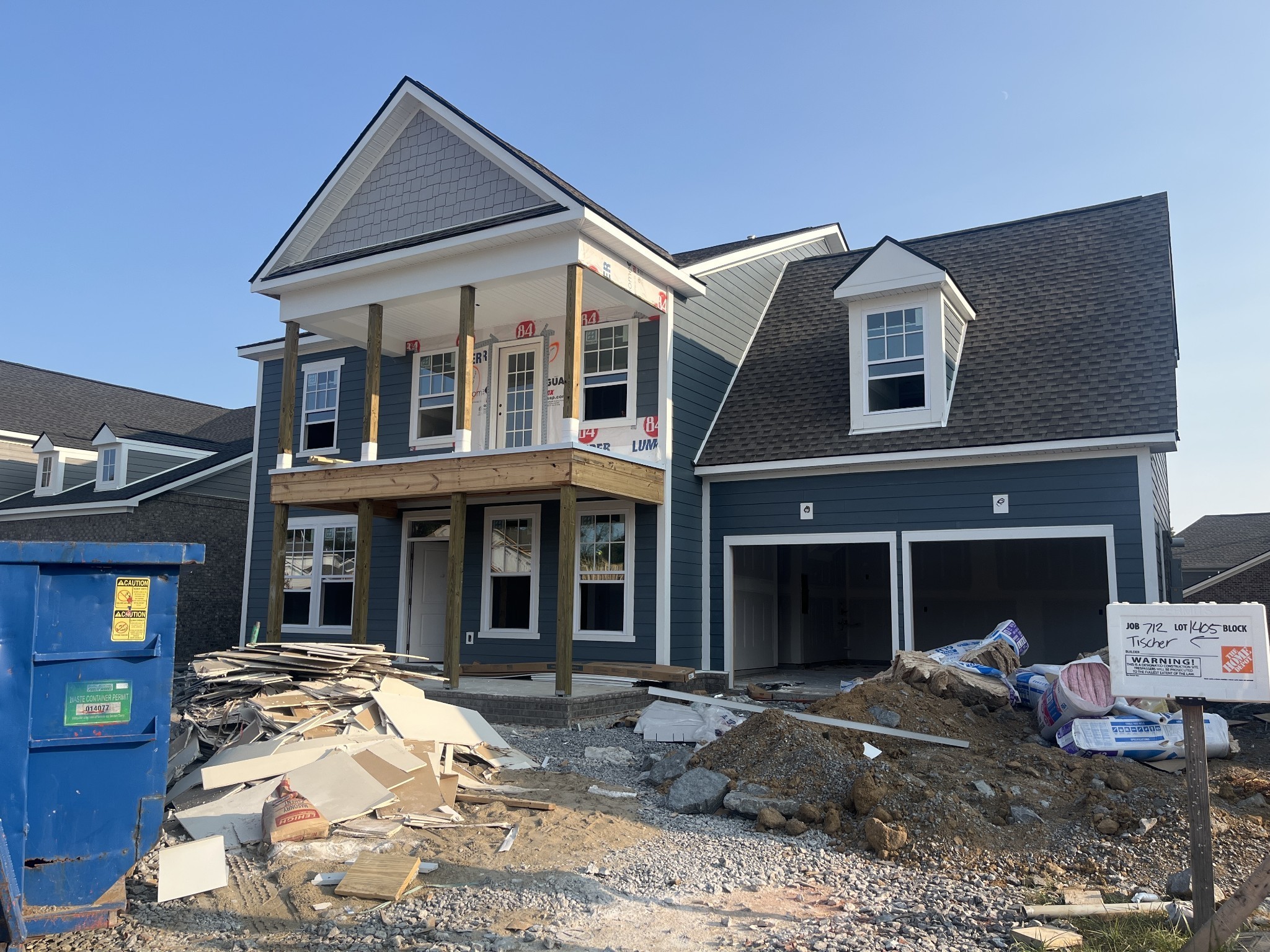 a front view of a house with seating space