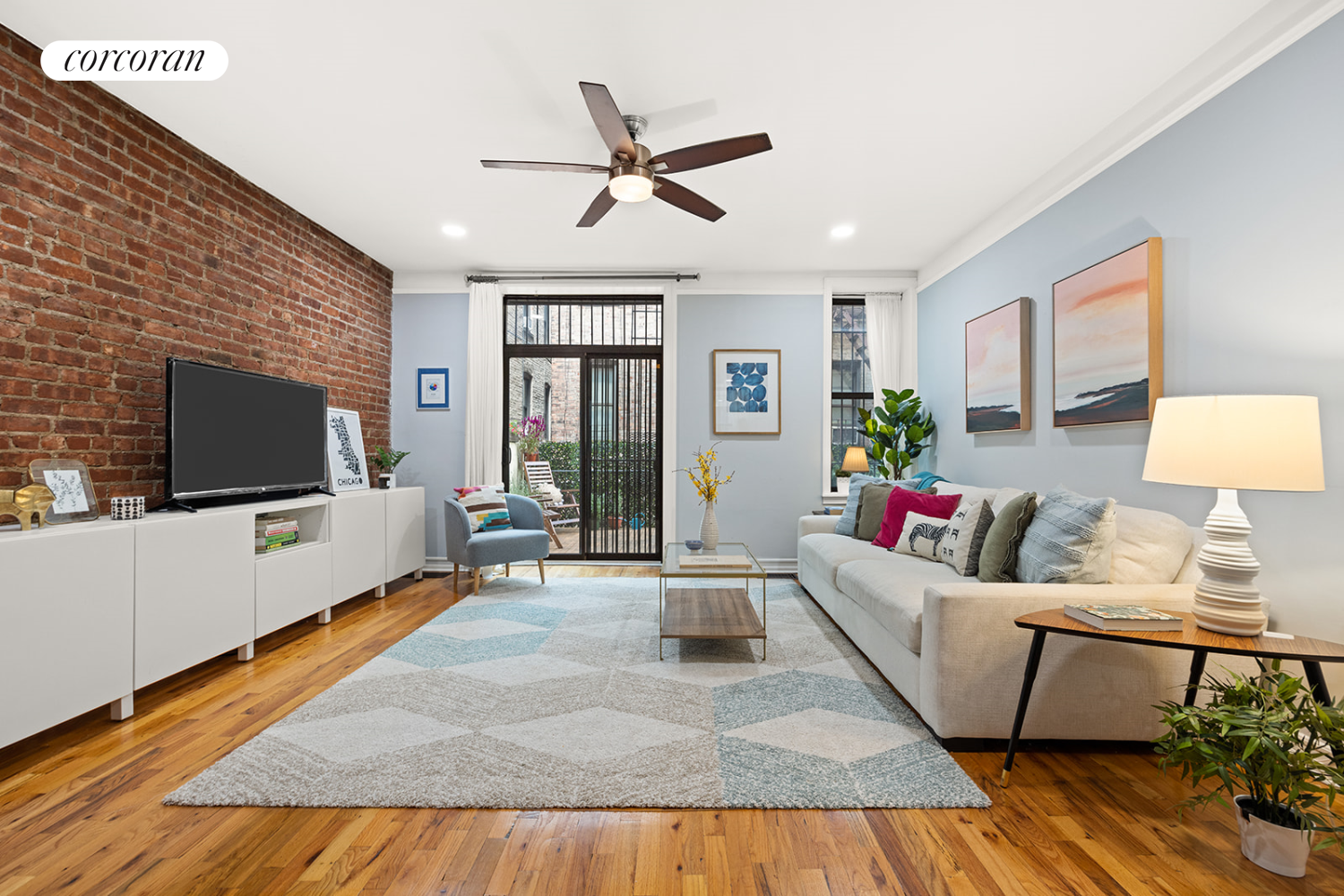 a living room with furniture and a flat screen tv