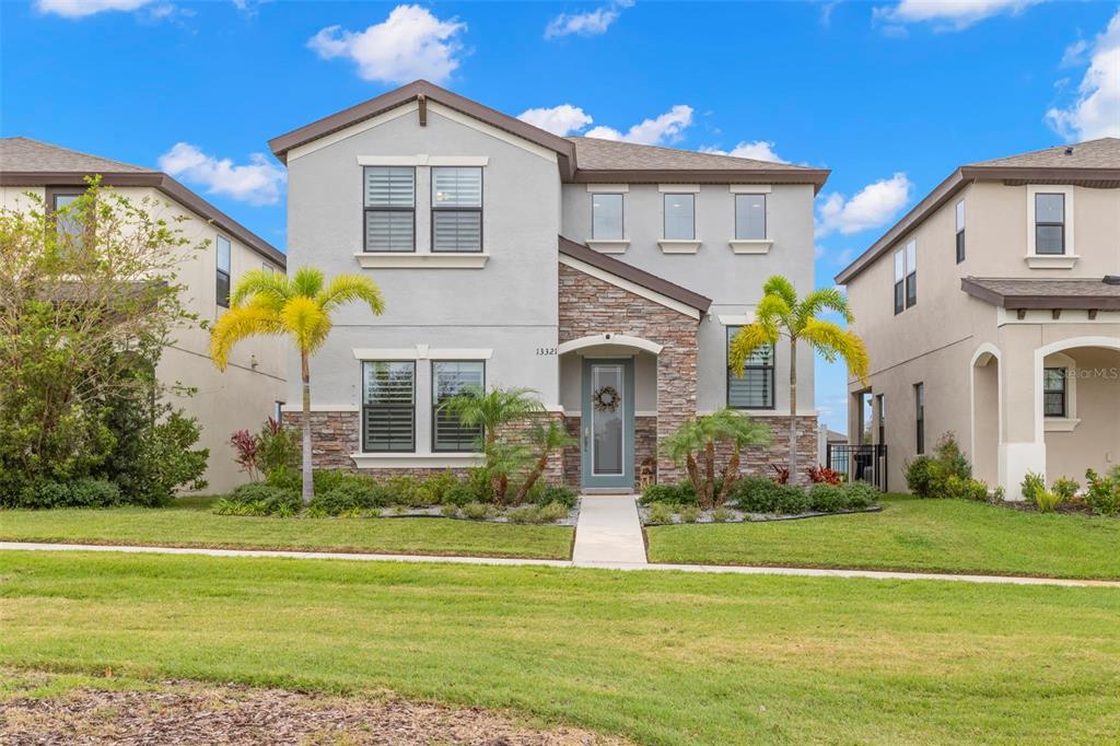 a front view of a house with a yard