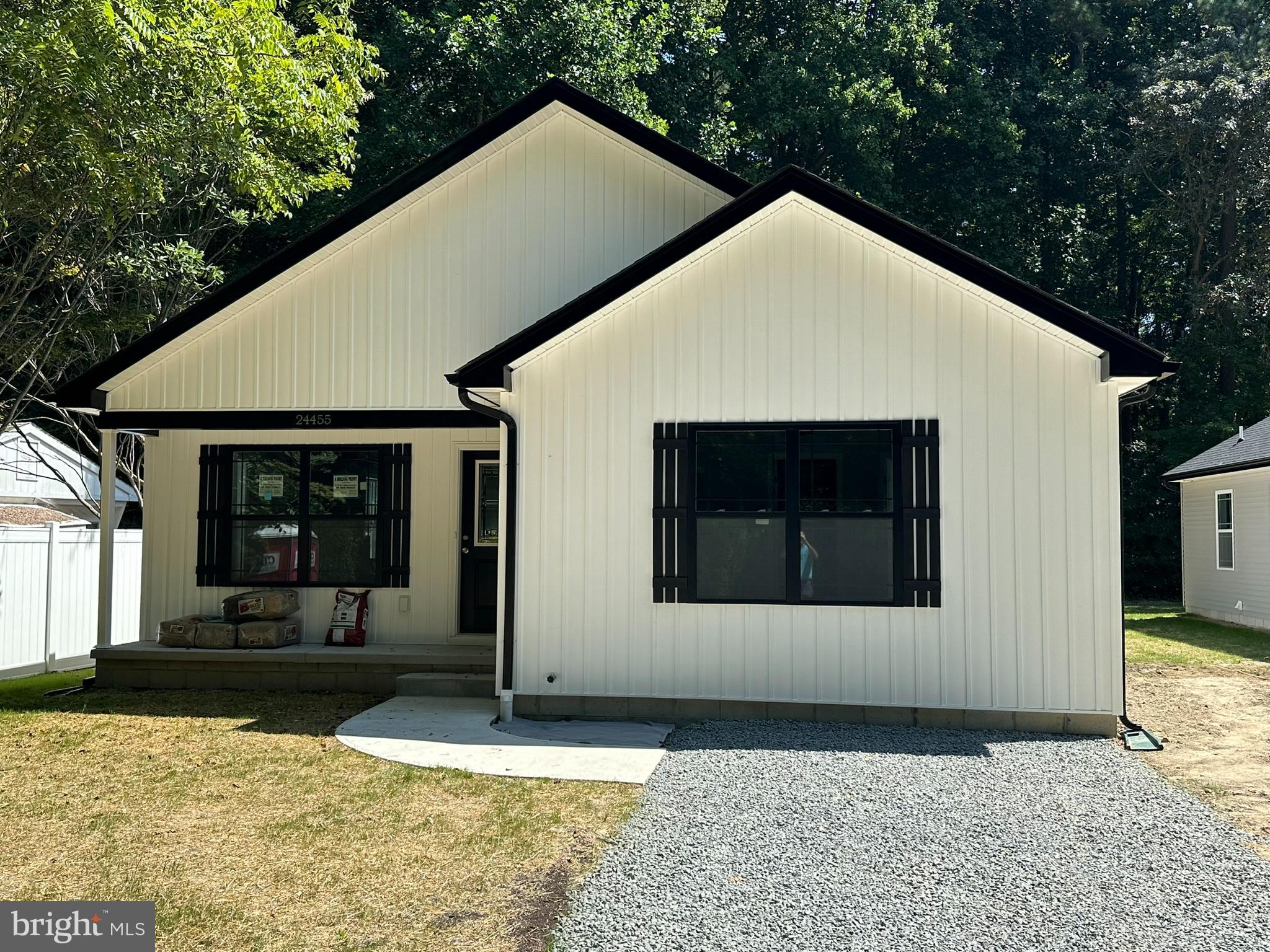 a front view of a house with yard